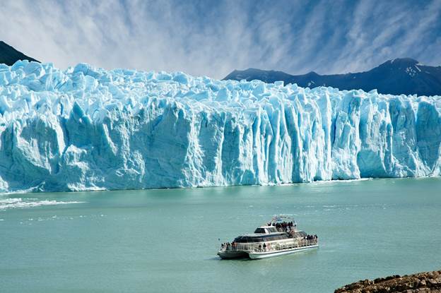 http://www.travel247.ie/contentFiles/Perito-Moreno-Glacier-bigstock-Boat-Sailing-Near-Perito-Moren-4934315.jpg